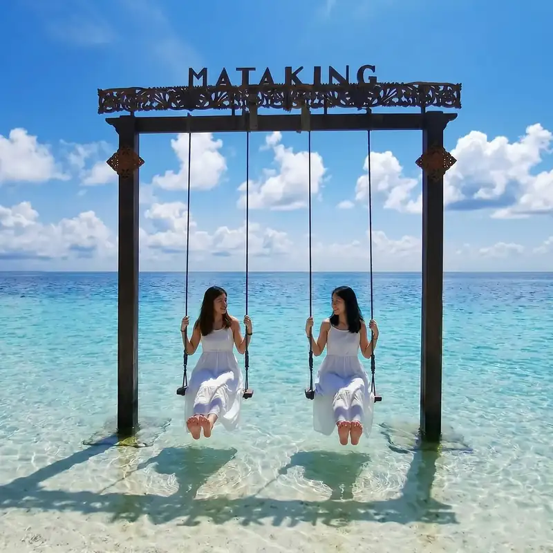 The Mataking Island sandbar emerging at low tide, connecting Mataking Besar and Mataking Kecil