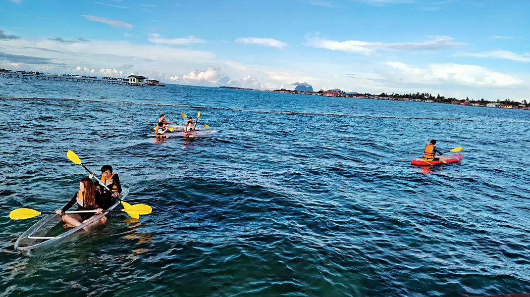 Sea kayaking in the calm turquoise waters near Sea Star Resort, Semporna